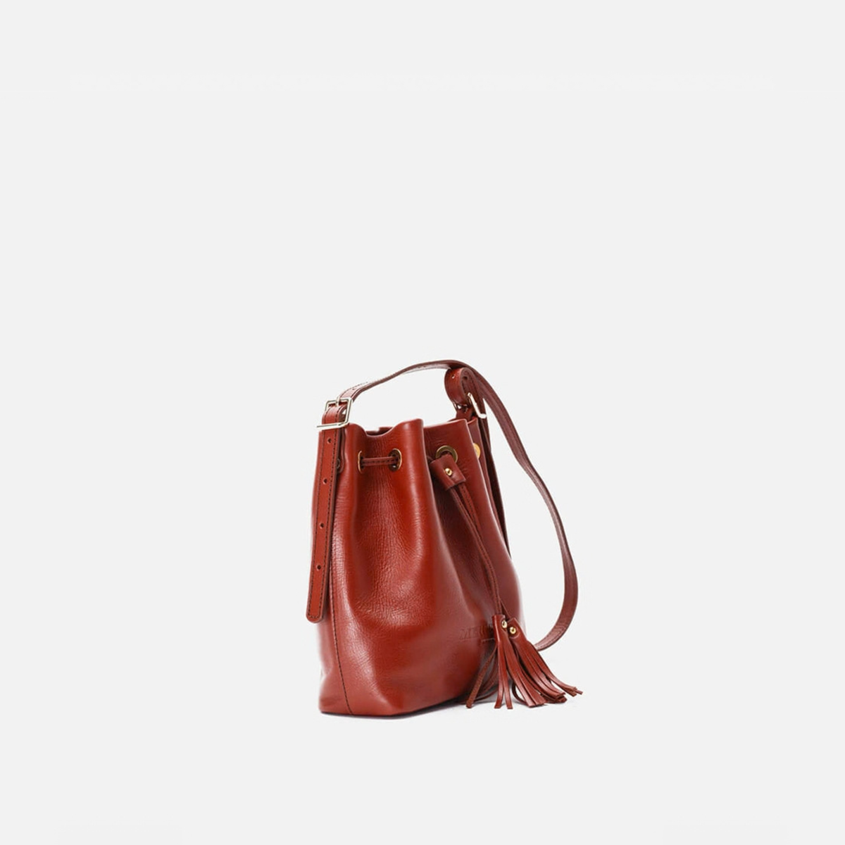 Otra vista: bolso bombonera de piel Pampa color teja, de Mercules