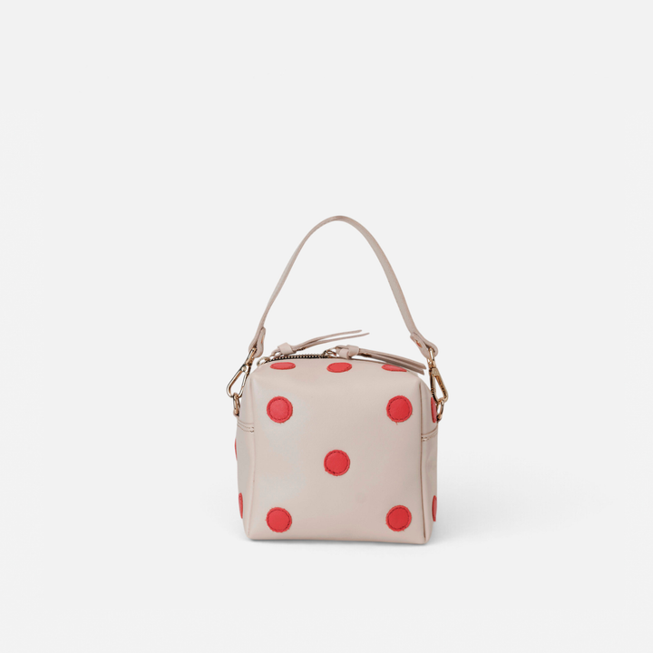 Dado Blanco y Rojo de Mercules – bolso de piel con forma de dado blanco con puntos rojos, hecho a mano en España